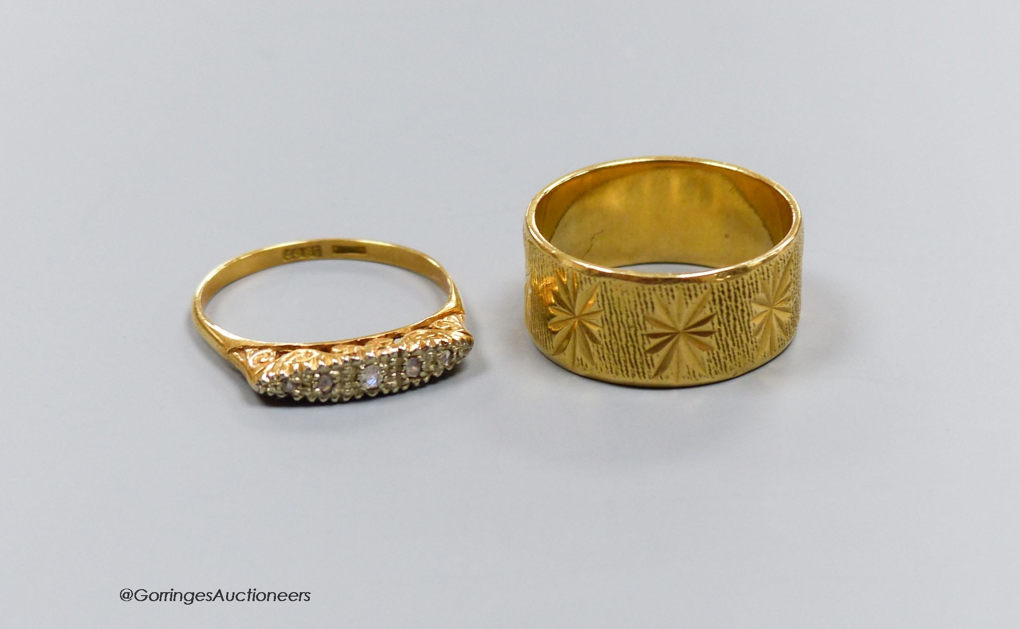 An 18ct engraved gold ring, size Q, 7.1g, and another 18ct gold and diamond ring with scroll-carved mount, size Q, gross 2.8g. 9.9g